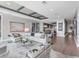 Open concept living room with modern furniture and decor, with views to the dining room and kitchen at 540 N Tamiami Trl # 1503, Sarasota, FL 34236