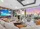 Chic living room with a fireplace, city view, and modern furnishings at 540 N Tamiami Trl # 1503, Sarasota, FL 34236
