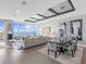 Open-concept living and dining area with ocean views and modern decor at 540 N Tamiami Trl # 1503, Sarasota, FL 34236