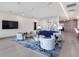 Lobby area featuring contemporary seating, a large television, and unique decor at 540 N Tamiami Trl # 1503, Sarasota, FL 34236