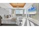 Bright main bedroom with floor-to-ceiling windows, balcony access, and decorative ceiling at 540 N Tamiami Trl # 1503, Sarasota, FL 34236