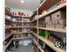 Well-organized walk-in pantry with custom shelving, providing ample storage space for kitchen essentials at 540 N Tamiami Trl # 1503, Sarasota, FL 34236