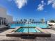 Relax in the rooftop hot tub and pool area with stunning ocean views and lounge chairs at 540 N Tamiami Trl # 1503, Sarasota, FL 34236
