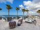 Rooftop lounge featuring comfortable seating with ocean views, lounge chairs and palm trees at 540 N Tamiami Trl # 1503, Sarasota, FL 34236