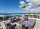 Rooftop lounge with stylish seating, a fire pit, and spectacular ocean views at 540 N Tamiami Trl # 1503, Sarasota, FL 34236