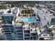 Aerial view of the rooftop pool featuring cabanas and lounge seating at 540 N Tamiami Trl # 1503, Sarasota, FL 34236
