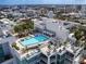 Aerial view of the rooftop pool featuring cabanas and lounge seating at 540 N Tamiami Trl # 1503, Sarasota, FL 34236