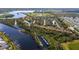 Beautiful aerial view showcasing a community with river access, boat docks, and nearby lakes and green spaces at 5515 Simonton St, Bradenton, FL 34203