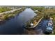 Stunning aerial view of a waterfront community with private docks and lush landscaping along a tranquil river at 5515 Simonton St, Bradenton, FL 34203