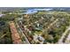 Neighborhood aerial shot featuring a lake, well-maintained streets, and beautifully landscaped properties in a Gathering-friendly area at 5515 Simonton St, Bradenton, FL 34203