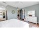 Bright bedroom featuring modern decor, including white dresser and ceiling fan at 5515 Simonton St, Bradenton, FL 34203