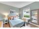 Beautiful bedroom with cozy decor, lots of light, and a wicker bench at 5515 Simonton St, Bradenton, FL 34203