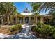 Charming clubhouse exterior with a welcoming entrance, lush landscaping, and elegant design at 5515 Simonton St, Bradenton, FL 34203