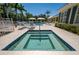 Relaxing community hot tub surrounded by lush landscaping and comfortable lounge chairs at 5515 Simonton St, Bradenton, FL 34203