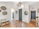Bright foyer with hardwood floors, elegant lighting, and decorative accents creating a warm welcome at 5515 Simonton St, Bradenton, FL 34203