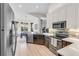 Well-lit kitchen with stainless steel appliances, breakfast nook and stone tile backsplash at 5515 Simonton St, Bradenton, FL 34203