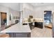 Bright kitchen featuring white and dark cabinets, a marble countertop island, and stainless steel appliances at 5515 Simonton St, Bradenton, FL 34203