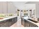 Kitchen with white cabinets, granite counters, eat in dining, and stainless steel appliances at 5515 Simonton St, Bradenton, FL 34203