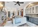 Open living area showcasing hardwood floors, modern wet bar, and seamless flow to other living spaces at 5515 Simonton St, Bradenton, FL 34203