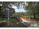 Scenic walkway with wooden railings leading to Harbor Walk, Island Way, and Everglades, Gulf of Mexico sign at 5515 Simonton St, Bradenton, FL 34203