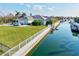 An aerial view of a home on a canal showcases waterfront living at its finest at 556 Regatta Way, Bradenton, FL 34208