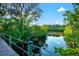 Picturesque boardwalk leading to a serene waterfront view, perfect for nature walks at 556 Regatta Way, Bradenton, FL 34208