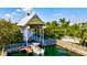 Scenic boat dock with a boat lift, perfect for enjoying waterfront living and boating at 556 Regatta Way, Bradenton, FL 34208
