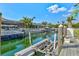 A private boat dock featuring boatlifts provides access to a tranquil canal at 556 Regatta Way, Bradenton, FL 34208
