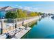 Dock with boat lift and peaceful canal views with boat, and home in the background at 556 Regatta Way, Bradenton, FL 34208