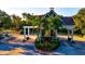 Beautiful community entrance surrounded by lush landscaping and manicured grounds at 556 Regatta Way, Bradenton, FL 34208