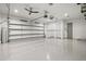 Spacious two-car garage with epoxy flooring, fans, storage and high ceilings at 556 Regatta Way, Bradenton, FL 34208