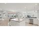 Open concept kitchen featuring a center island and stainless steel dishwasher at 556 Regatta Way, Bradenton, FL 34208