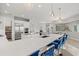 Large kitchen with center island, stainless appliances, and bar seating at 556 Regatta Way, Bradenton, FL 34208