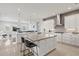 Spacious kitchen with center island, stainless steel appliances, and pendant lighting at 556 Regatta Way, Bradenton, FL 34208