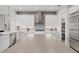 Bright kitchen featuring a large island, stainless steel appliances, and a walk in pantry at 556 Regatta Way, Bradenton, FL 34208