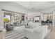 Bright living room with access to the outdoor living area and an open flow to the kitchen at 556 Regatta Way, Bradenton, FL 34208