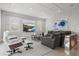 Comfortable living room featuring a large TV, stylish furniture, and elegant decor at 556 Regatta Way, Bradenton, FL 34208