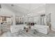 Bright and airy living space with an open layout featuring stylish furniture and modern finishes at 556 Regatta Way, Bradenton, FL 34208