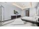 Relaxing main bedroom with TV, modern furniture, and large closet at 556 Regatta Way, Bradenton, FL 34208
