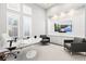 Bright office space with modern furnishings, including a tulip table, comfortable chairs, and a wall-mounted TV at 556 Regatta Way, Bradenton, FL 34208