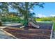 Community playground surrounded by greenery, perfect for Gathering fun at 556 Regatta Way, Bradenton, FL 34208