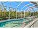 A clear, blue pool is screened-in, offering privacy and unobstructed sunlight at 556 Regatta Way, Bradenton, FL 34208