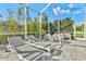 Pool deck with a lounge area enclosed in a screened lanai at 556 Regatta Way, Bradenton, FL 34208