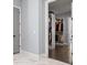 Neatly organized walk-in closet with custom shelving and hardwood floors, offering ample storage space at 556 Regatta Way, Bradenton, FL 34208
