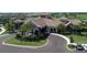 Elegant clubhouse featuring a grand entrance, lush landscaping, and convenient parking at 5694 Palmer Cir # 204, Lakewood Ranch, FL 34211
