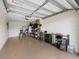 Spacious garage with overhead door, ample storage on shelves, and room for parking and organizing at 5694 Palmer Cir # 204, Lakewood Ranch, FL 34211