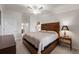 Relax in this well-lit bedroom featuring a unique headboard and cozy furnishings for a serene retreat at 5694 Palmer Cir # 204, Lakewood Ranch, FL 34211