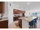 Beautiful open kitchen features stainless appliances, granite counters and a breakfast bar with seating for four at 5694 Palmer Cir # 204, Lakewood Ranch, FL 34211