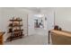 Bright home office featuring neutral walls, a view through open doors, and shelving for storage at 5694 Palmer Cir # 204, Lakewood Ranch, FL 34211