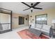 This spacious patio features a comfortable seating area and ceiling fan for enjoying outdoor living year-round at 5694 Palmer Cir # 204, Lakewood Ranch, FL 34211